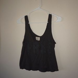 Tank top says “free”